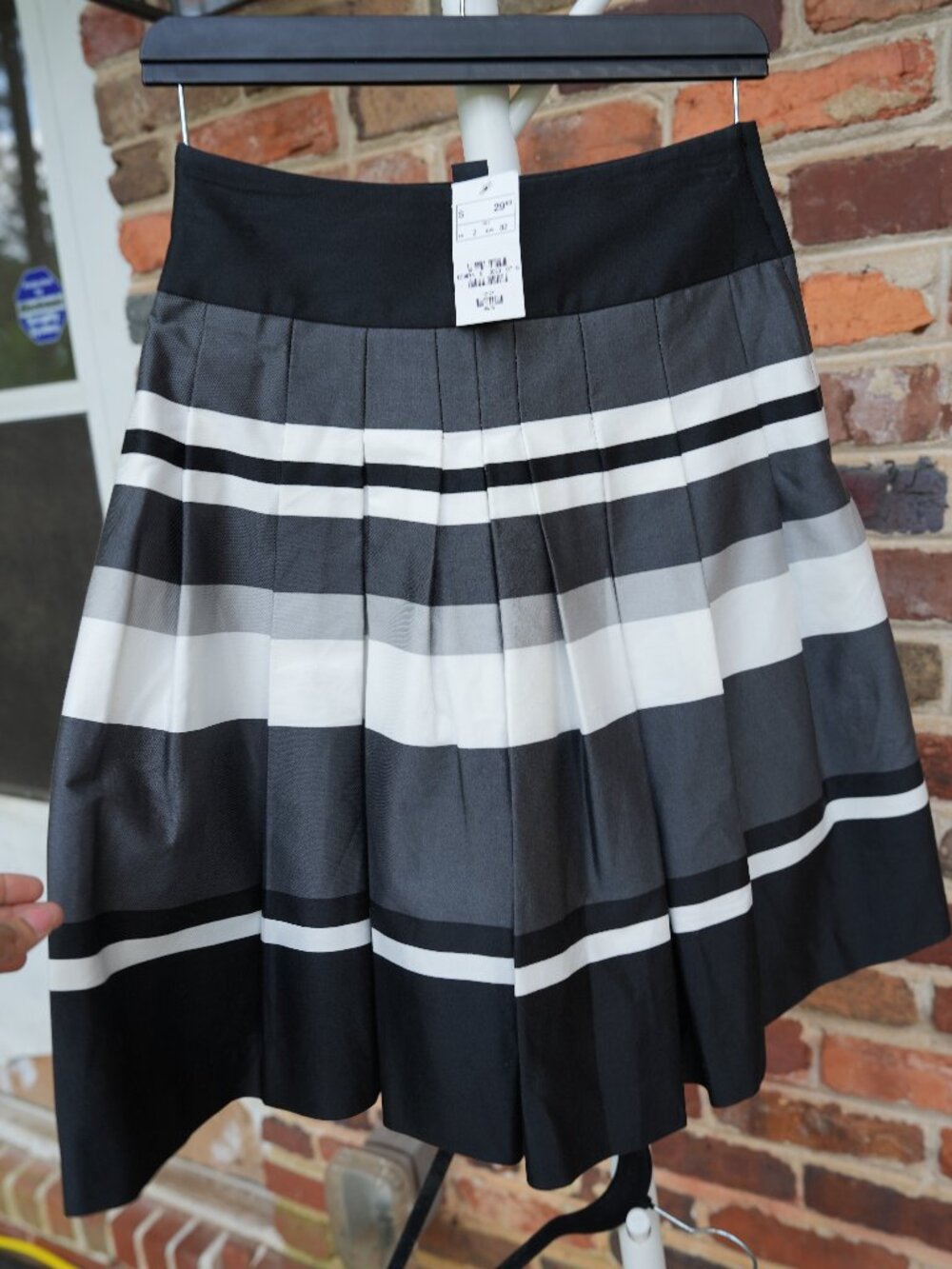 H&M black, grey, and white striped pleated skirt with a wide black waistband